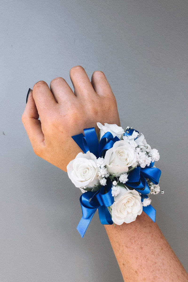 White Wrist Corsage With Blue Ribbon